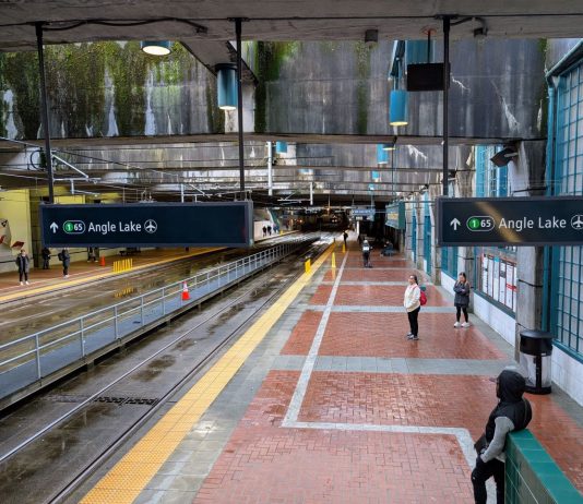 Sound Transit CEO Lays Out Approach to Second Seattle Rail Tunnel A view of the platform at International District Station from partway up the escalator. A few dozens passengers are waiting for trains.
