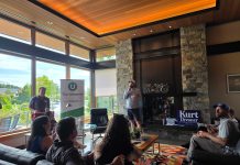 Join Us for The Urbanist Winter Holiday Party on December 9th Doug Trumm speaks in front of a group of urbanist supporters with a fireplace behind.