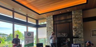 Join Us for The Urbanist Winter Holiday Party on December 9th Doug Trumm speaks in front of a group of urbanist supporters with a fireplace behind.