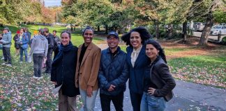 Urbanist Podcast Election Extravaganza: Puget Sound Progressives Prevail The five candidates stand shoulder to shoulder in Columbia Park, which is lined with trees in full autumn colors.