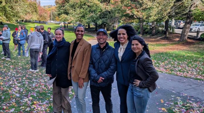 Urbanist Podcast Election Extravaganza: Puget Sound Progressives Prevail The five candidates stand shoulder to shoulder in Columbia Park, which is lined with trees in full autumn colors.