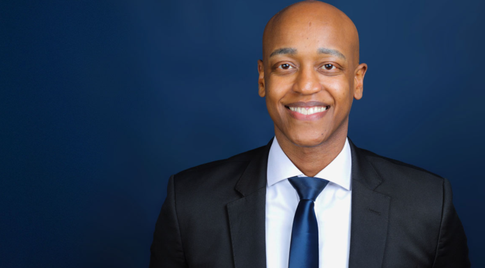 After Victory, Zahilay Announces County Executive Transition Team Girmay Zahilay, a Black millennial man wearing a suit, standing in front of a blue background