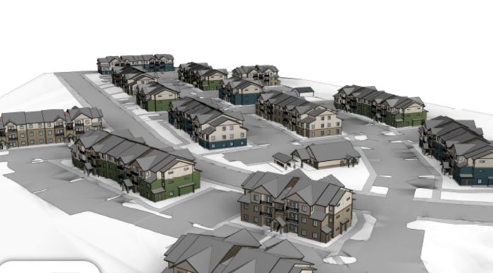 Pierce County Boosts Affordable Housing Creation, Leveraging New Maureen Howard Fund A rendering shows a cluster of lowrise apartment buildings surrounded by surface parking and access roads.