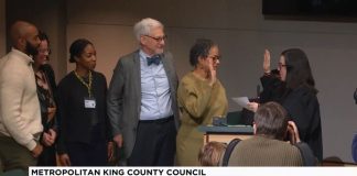 King County Council Appoints Top Zahilay Aide to Vacant Council Seat Lewis holds up her right hand to do the oath of office with a King County judge. Lewi's family is by her side.