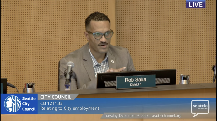 Screenshot 2025-12-09 at 3.09.53 PM Councilmember Rob Saka sits on the council dais in a tan sportscoat.