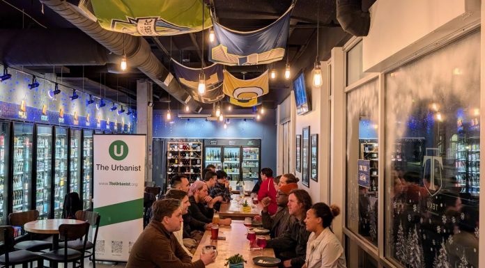 Join Us for February Urbanist Socials and Waterways Presentation March 3rd About 20 urbanists sit around a long table in the tavern.